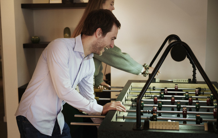 man playing soccer machine